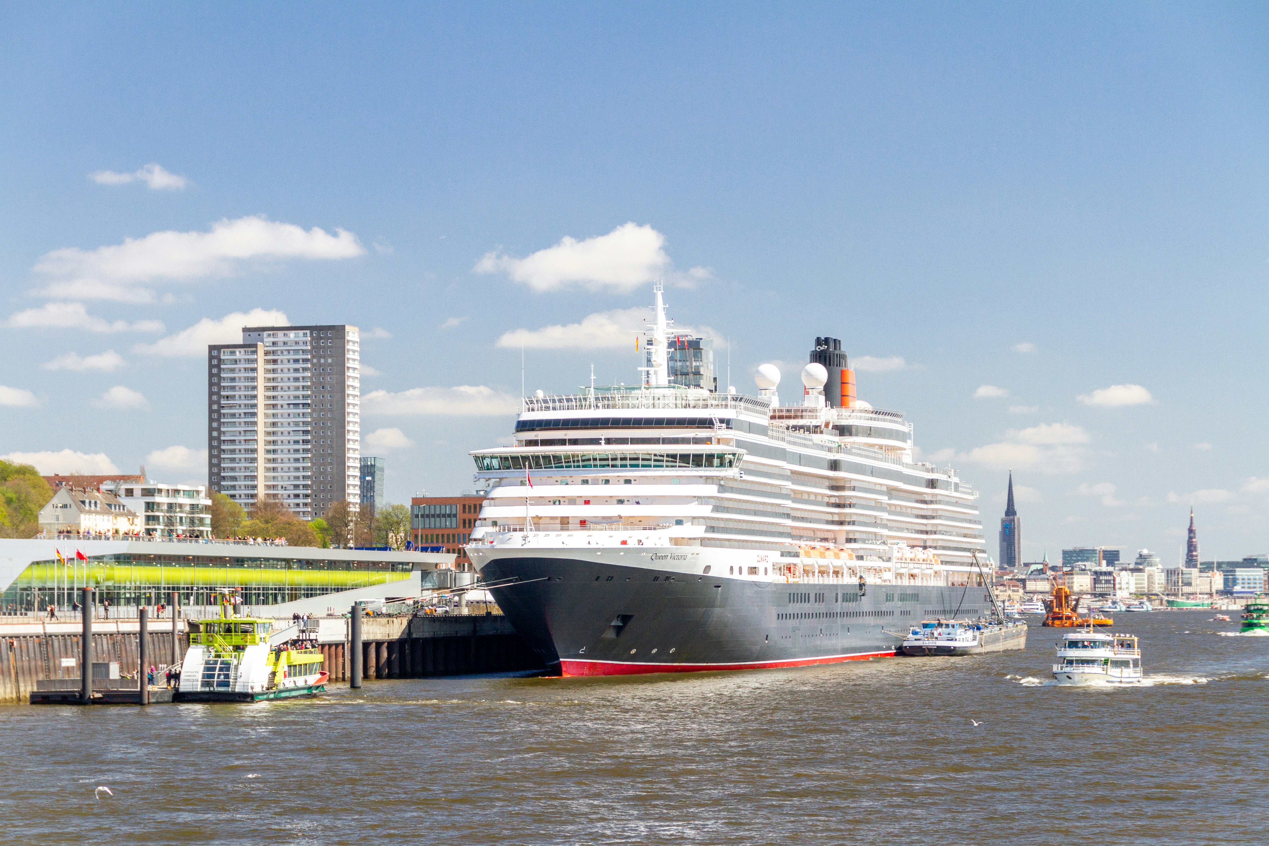 white and black cruise ship on dock during daytime